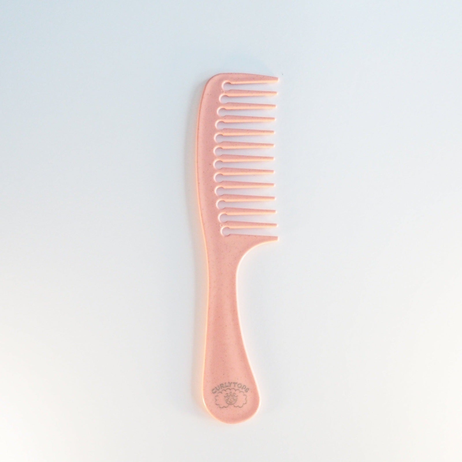 The Curlytops Biodegrable Wheat Straw comb for styling curly hair